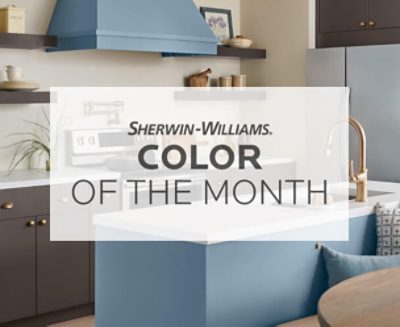 Sherwin Williams Color of the Month text over a kitchen with Smoky Azurite painted on the walls.