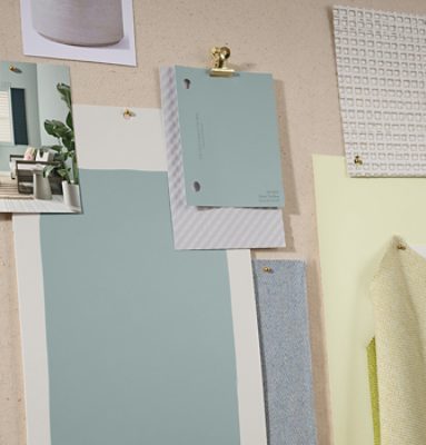 Pinboard with a photo of a room, paint color samples, drawdowns, and inspiration imagery in soft blues and yellows.
