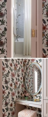 A stylish bathroom with trim, door, and built-in cabinets in Sherwin-Williams Abalone Shell, featuring a shower next to a floral wallpapered vanity area with a round mirror and a small vase of pink flowers.