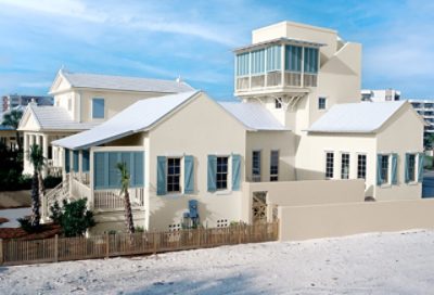 A neutral painted beach house with blue trim. S-W colors featured: SW 7568, SW 7432, SW 7614