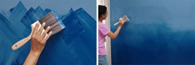A person blending in blue paint to create an ombre wall.