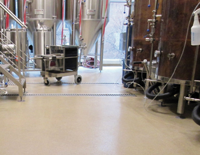 drains in a floor at a brewery