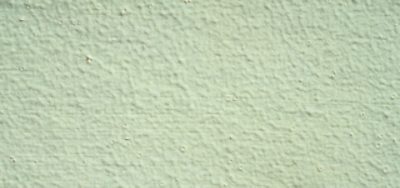 A close up of a wall that has bubbling fisheye paint