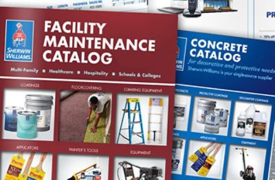 Un primer plano de los catálogos de mantenimiento de instalaciones y de concreto para contratistas de pintura.