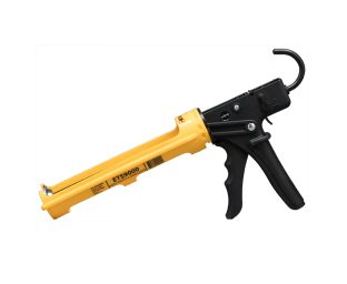 A black and yellow caulk gun.