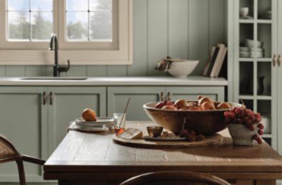 A kitchen painted Evergreen Fog SW 9130.