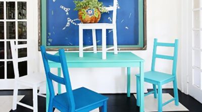 A freshly painted set of wooden chairs and a table