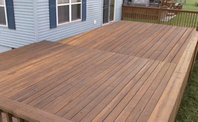 A wooden backyard patio deck.