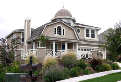 A coastal home with cream paint colors and white trim. S-W colors featured: SW 6073, SW 7005, SW 6244