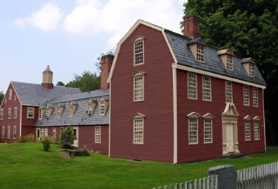 A coastal home with red paint and sand-colored trimming. S-W colors featured: SW 7594, SW 7532, SW 7513