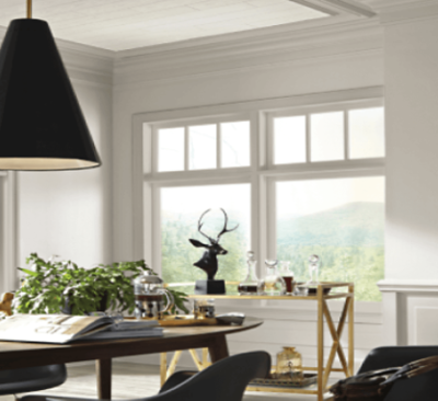 A dining room with all white walls and trim.