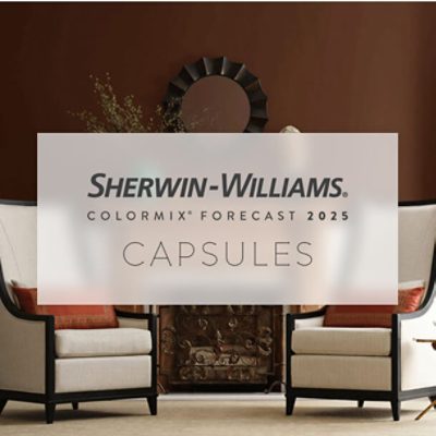 A room with two beige armchairs with black frames and orange cushions, placed on either side of a fireplace. A circular decorative mirror hangs above the fireplace on a rich brown wall. Overlaid text reads "SHERWIN-WILLIAMS® COLORMIX® FORECAST 2025 CAPSULES."
