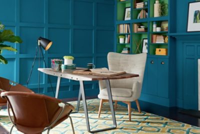 A home office painted a bold blue.