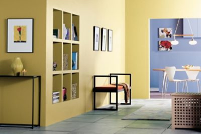 A large entryway painted a cheerful yellow.