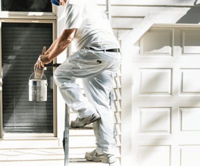 A painter on a ladder.