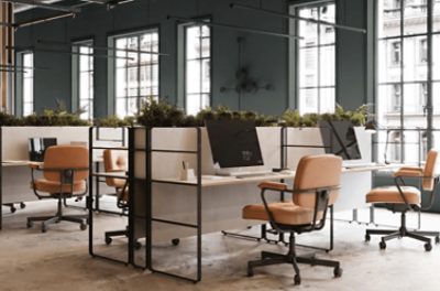 An industrial office with open concept desks.