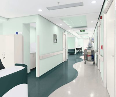 A hospital hallway with walls painted Slow Green SW6456.