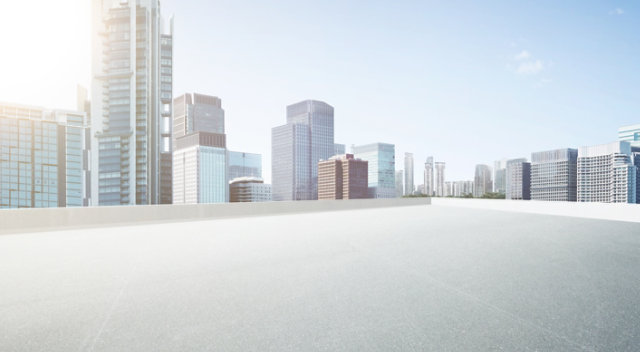 Skyscrapers in the distance with EPS style roof coatings in the foreground