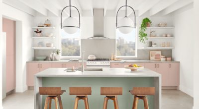 A kitchen with bottom cabinets painted Sashay Sand.