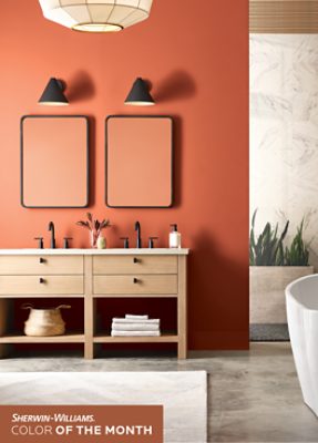 Bathroom walls painted in SW 6349 Pennywise, black hardware and wooden vanity.
