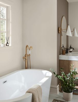 A large soaking tub in a bathroom painted Shoji White SW 7042.