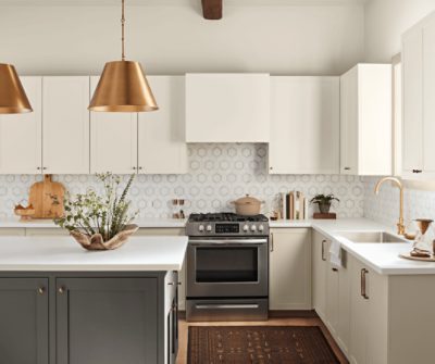 A kitchen with cabinets painted Shoji White SW 7042