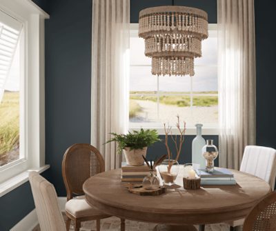 Dining room with windows painted in Silvermist SW 7621.