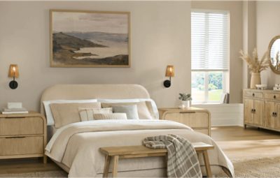 Bedroom painted in SW 9173 Shiitake, neutral bedding and nightstands, minimal decor.