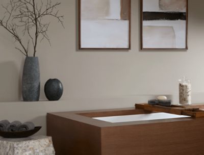 Modern bathroom with wooden bathtub, walls painted in SW 9172 Studio Clay.
