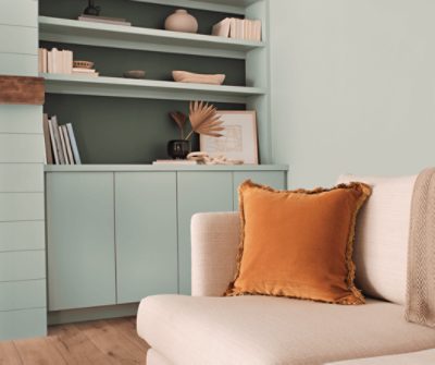 Living room painted in SW 0068 Copen Blue with built-ins and a fireplace