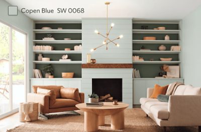 Living room painted in SW 0068 Copen Blue with built-ins and a fireplace