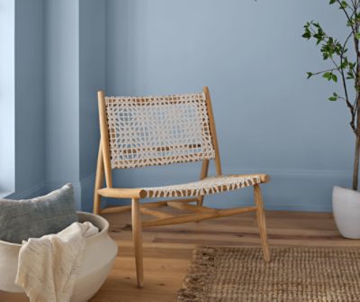 A macramé chair in a room painted Aleutian SW 6241.