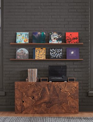 Brick wall painted in SW 7675 Sealskin with shelves of records and record player on a table.