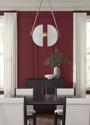 Dining room painted in SW 7578 Borscht, two large windows with curtains, table and four chairs.