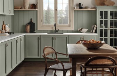 A kitchen with cabinets and backsplash painted Evergreen Fog.