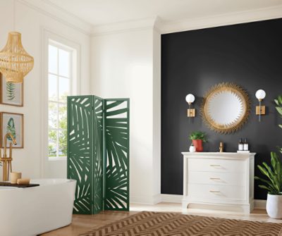 A wooden room divider with a palm leaf pattern painted Kale Green SW 6460.