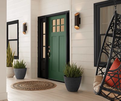 A craftsman-style front door painted Kale Green SW 6460.