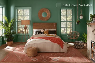 A boho-inspired bedroom painted Kale Green SW 6460.