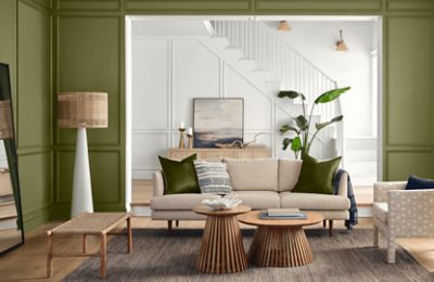 A living room painted Basque Green.