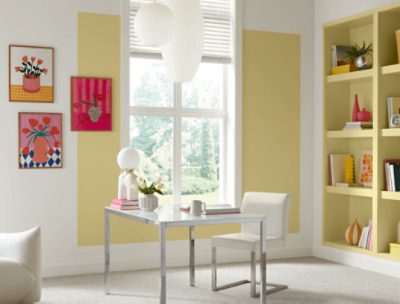 Office area painted in SW 1667 Icy Lemonade, with built in shelves full of books and decor, a white desk and chair.