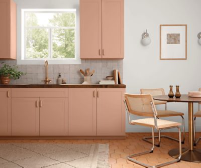 A kitchen with cabinets painted SW 0069 Rose Tan, Sherwin-Williams' May 2022 Color of the Month.