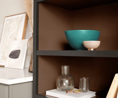 Open shelving painted in SW 6090 Java with minimalistic decor.