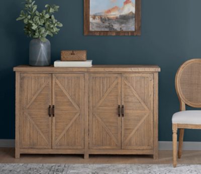 Walls painted dark blue behind a buffet with minimal decor.