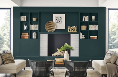 Built-in shelving surrounding a white brick fireplace painted Cascades.