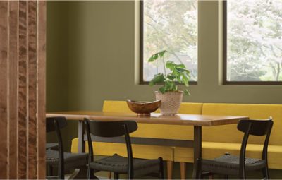 Kitchen table sitting area with walls painted in Palm Leaf SW 7735.