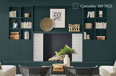 A living room with built-in shelving around the fireplace painted Cascades SW 7623.