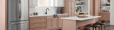 A bright kitchen with cabinets painted SW 9081 Redend Point.