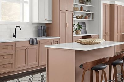 A bright kitchen with cabinets painted SW 9081 Redend Point.