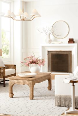 Living room painted Sherwin-Williams White Snow SW9541 with a wooden coffee table, chairs, and a white upholstered couch.