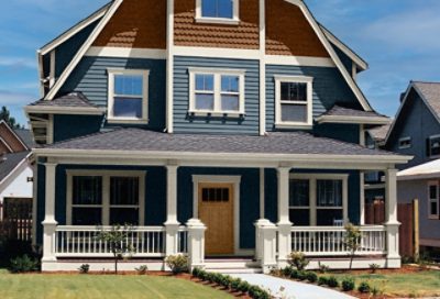 A navy craftsman home with white trim and an entry porch. S-W colors featured: SW 0032, SW 0050, SW 2853, SW 0045.
